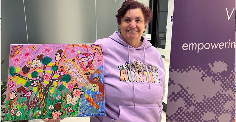 Photo of Aunty Jane and her artwork for WV's RAP - Reflect